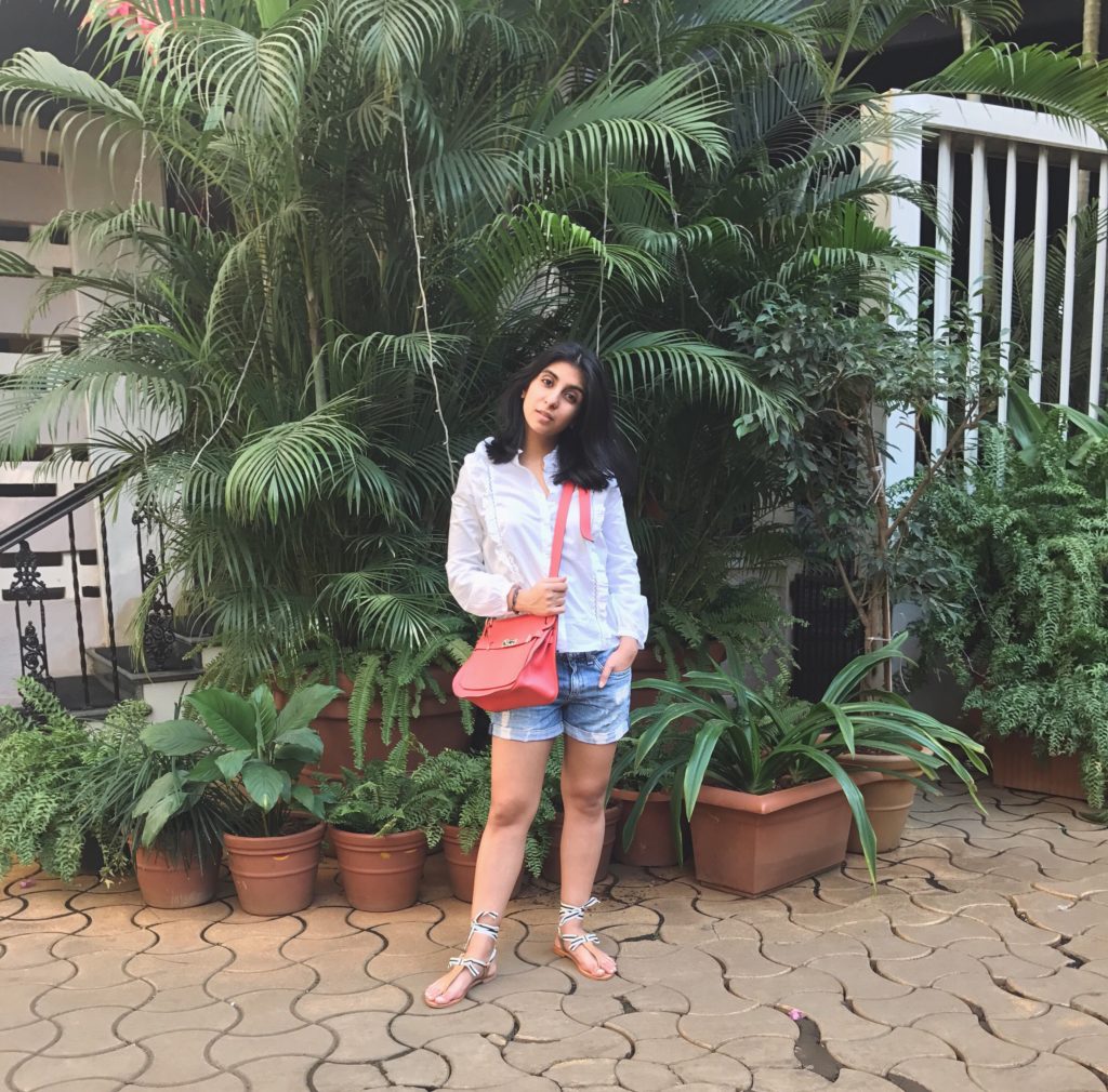 Fashion blogger Shloka Narang of The Silk Sneaker showcases all her street style looks from Mumbai featuring this Topshop ruffled shirt