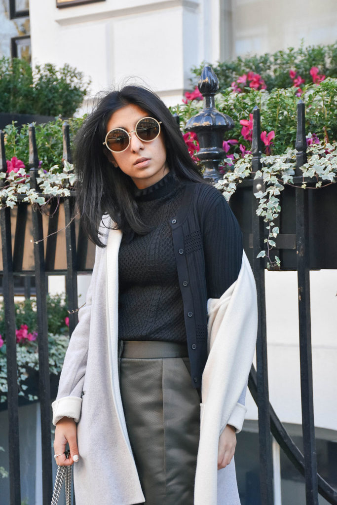 Fashion blogger Shloka Narang of The Silk Sneaker styles khaki Topshop pants and a Sandro sweater with a Gucci Bag