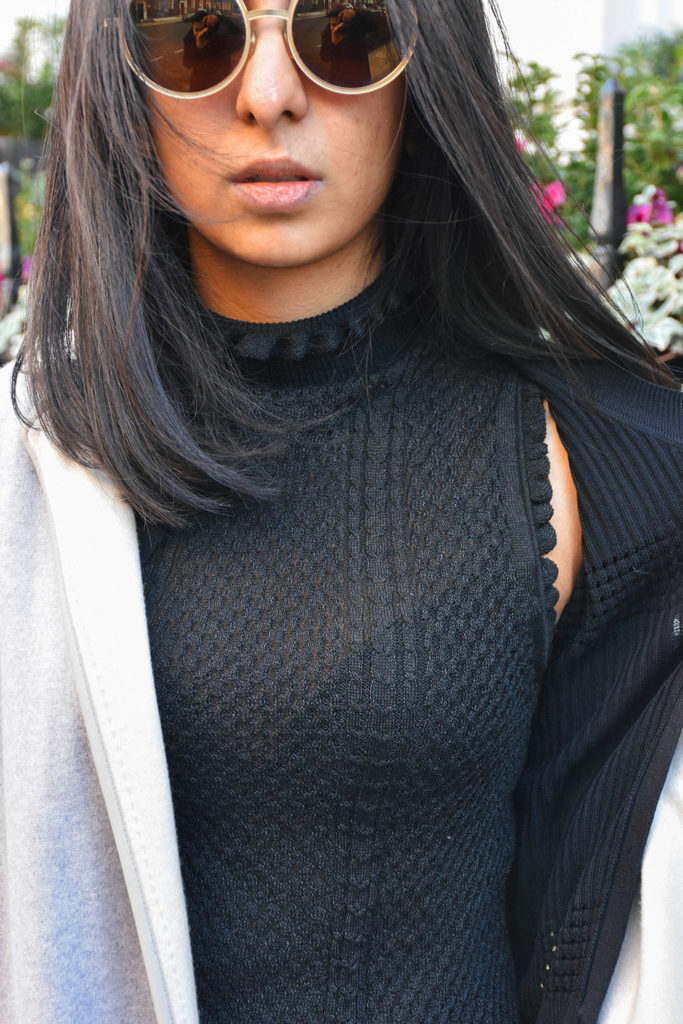 Fashion blogger Shloka Narang of The Silk Sneaker styles khaki Topshop pants and a Sandro sweater with a Gucci Bag