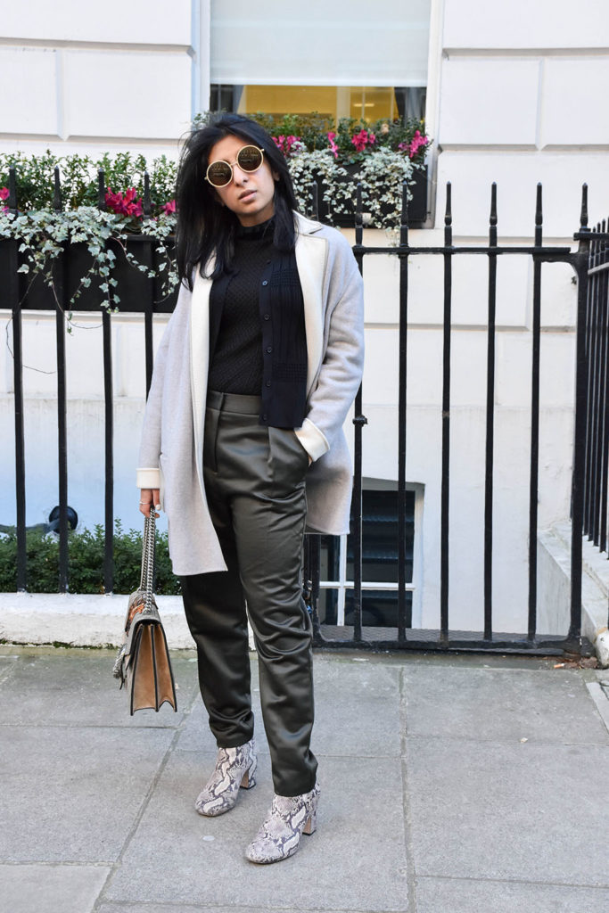 Fashion blogger Shloka Narang of The Silk Sneaker styles khaki Topshop pants and a Sandro sweater with a Gucci Bag