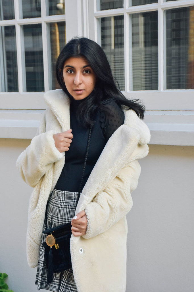 Fashion Blogger Shloka Narang of The Silk Sneaker shows how to style a teddy bear coat for the winter