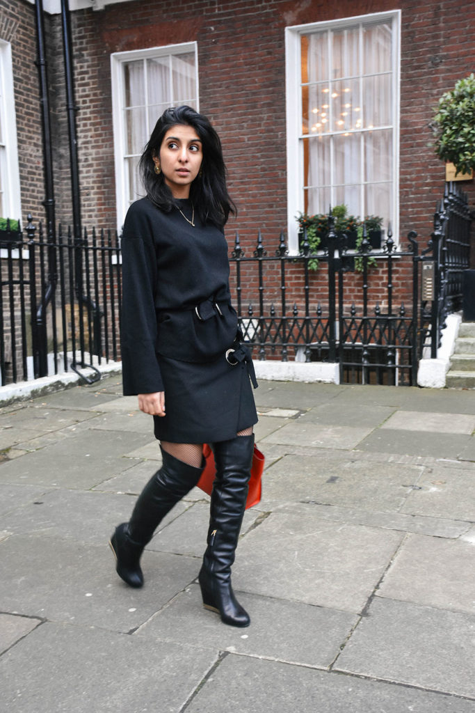 Fashion blogger Shloka Narang of The Silk Sneaker showcases how to style fishnet stockings and buckle skirts