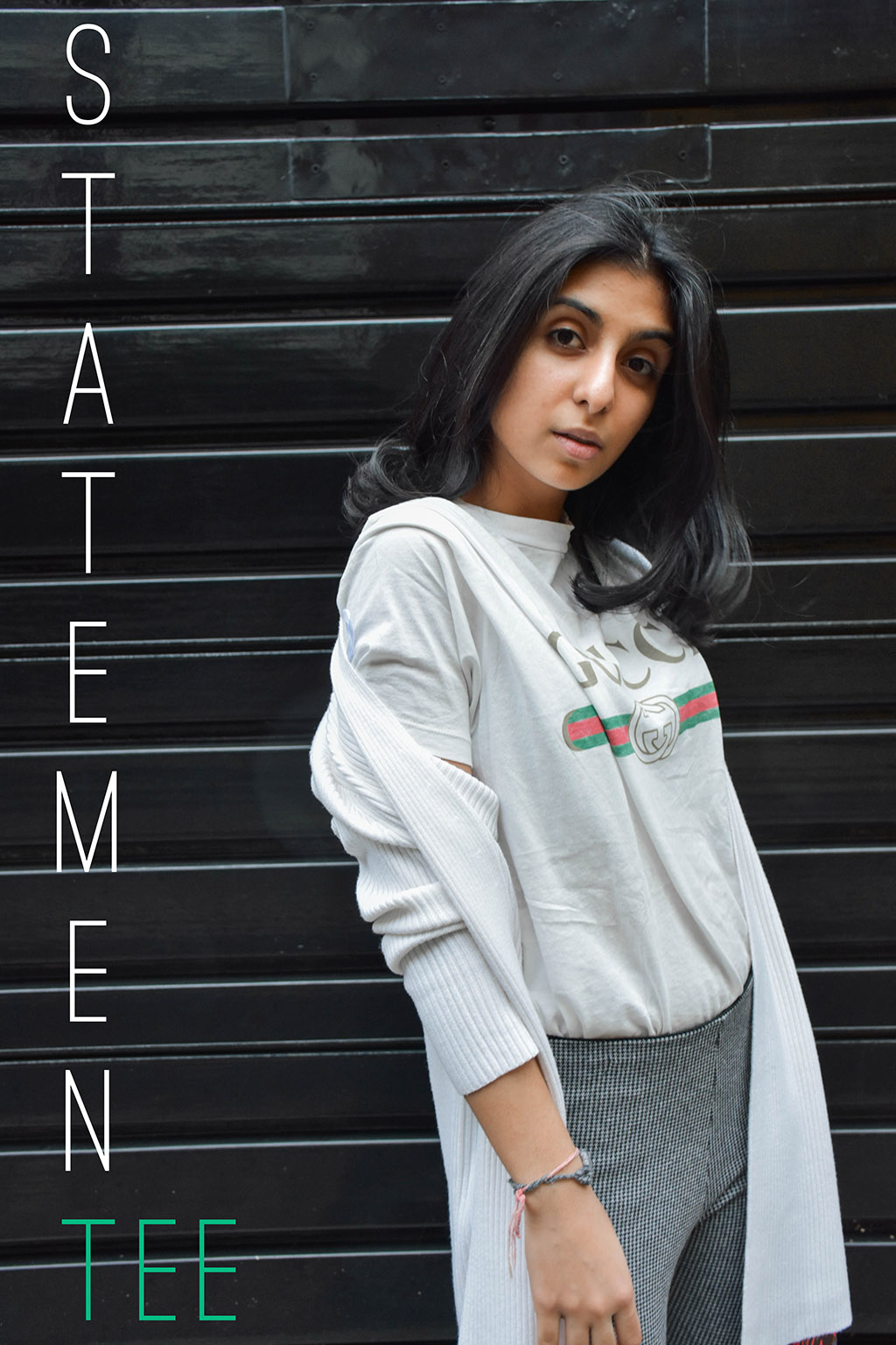 Fashion Blogger Shloka Narang of The Silk Sneaker styles a statement tee featuring a Gucci tee shirt and Louis Vuitton Clutch
