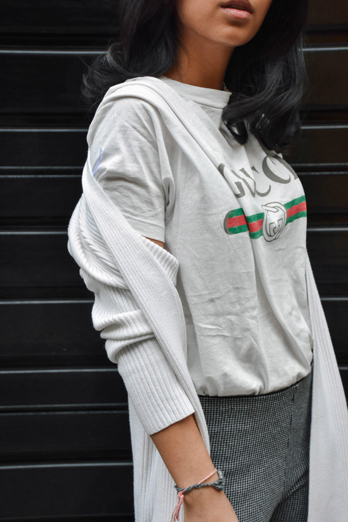 Fashion Blogger Shloka Narang of The Silk Sneaker styles a statement tee featuring a Gucci tee shirt and Louis Vuitton Clutch