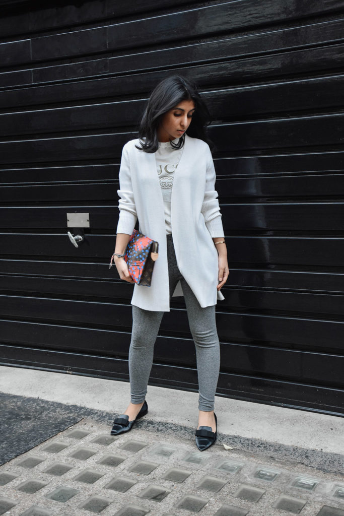 Fashion Blogger Shloka Narang of The Silk Sneaker styles a statement tee featuring a Gucci tee shirt and Louis Vuitton Clutch