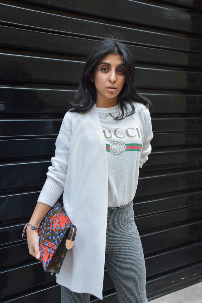 Fashion Blogger Shloka Narang of The Silk Sneaker styles a statement tee featuring a Gucci tee shirt and Louis Vuitton Clutch