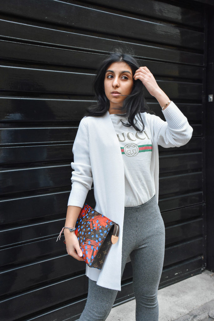 Fashion Blogger Shloka Narang of The Silk Sneaker styles a statement tee featuring a Gucci tee shirt and Louis Vuitton Clutch