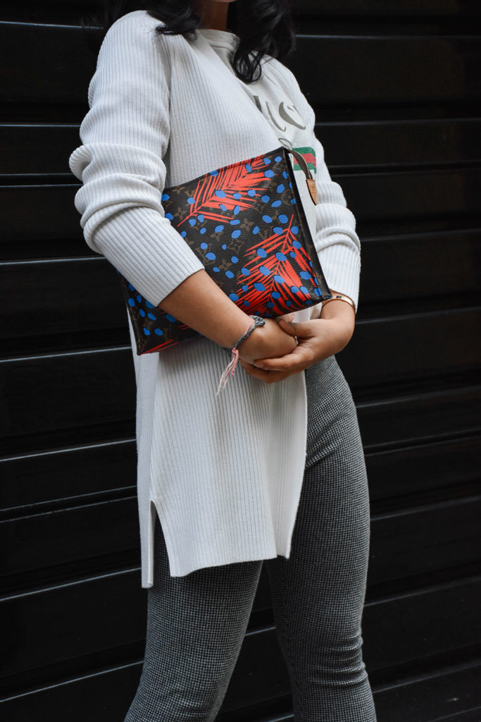 Fashion Blogger Shloka Narang of The Silk Sneaker styles a statement tee featuring a Gucci tee shirt and Louis Vuitton Clutch
