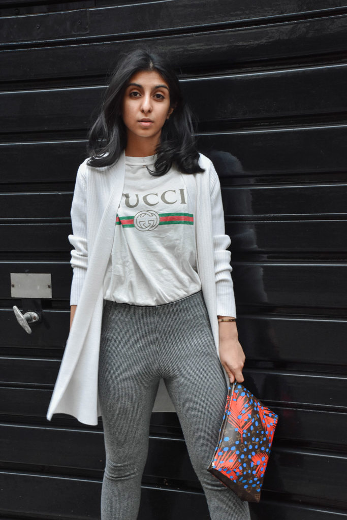 Fashion Blogger Shloka Narang of The Silk Sneaker styles a statement tee featuring a Gucci tee shirt and Louis Vuitton Clutch
