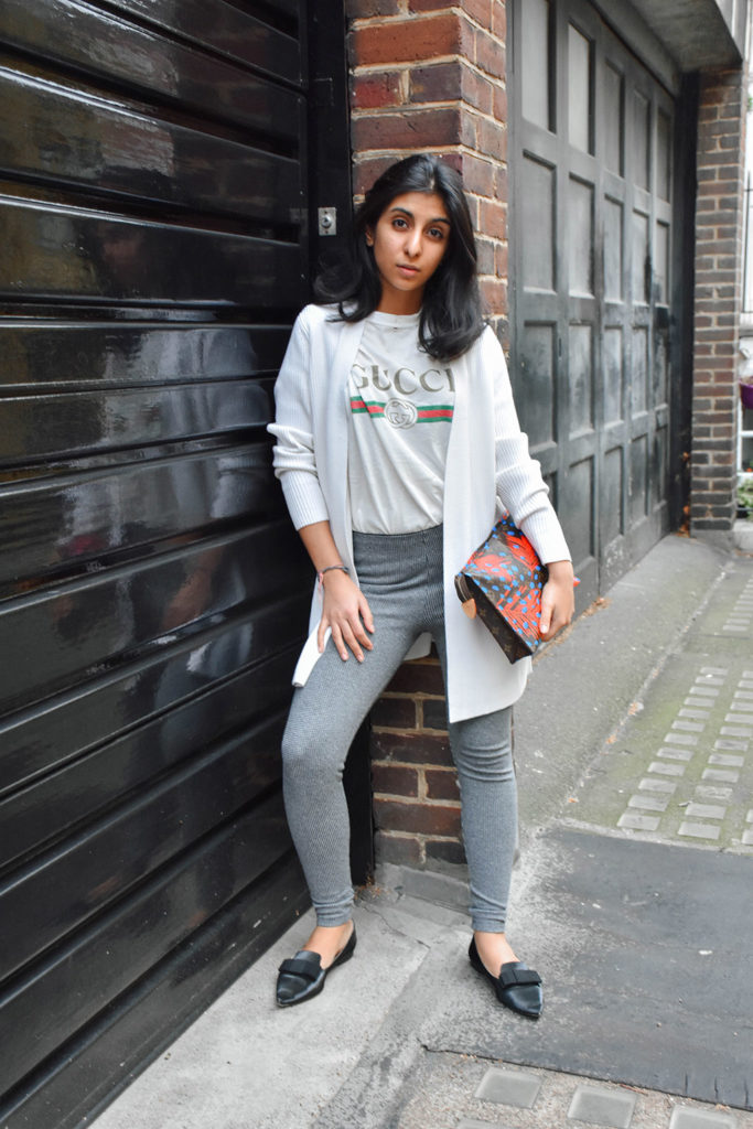 Fashion Blogger Shloka Narang of The Silk Sneaker styles a statement tee featuring a Gucci tee shirt and Louis Vuitton Clutch
