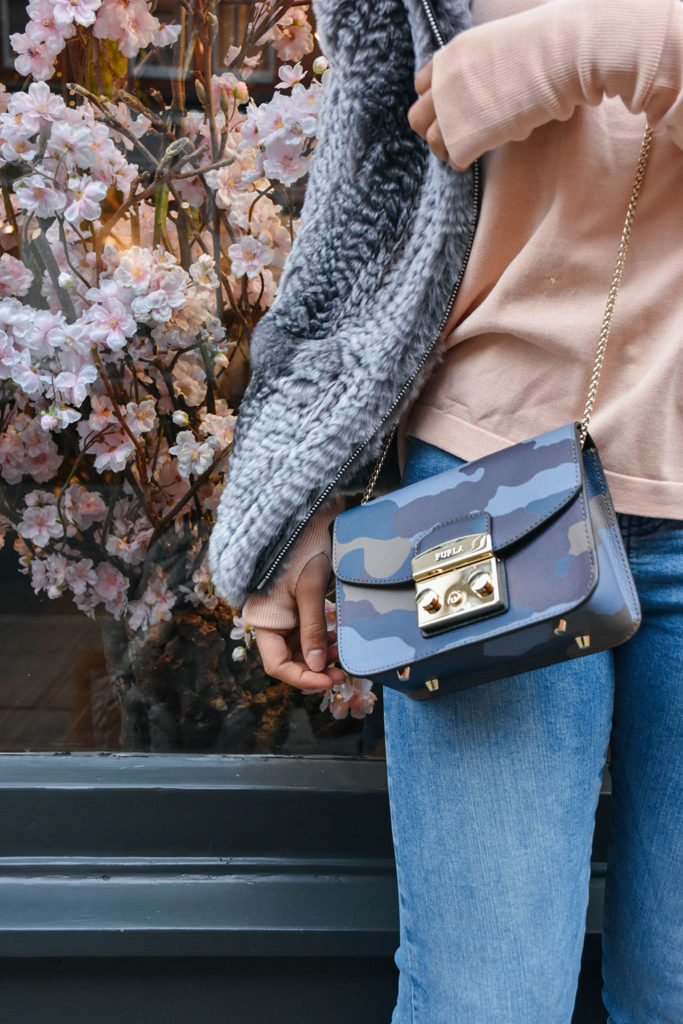 Fashion Blogger Shloka Narang of The Silk Sneaker showcases how to style and wear backless sweaters featuring this Furla bag