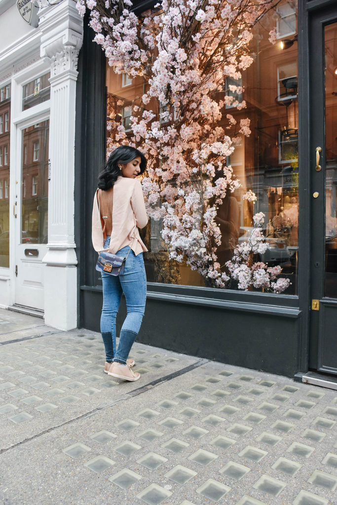 Fashion Blogger Shloka Narang of The Silk Sneaker showcases how to style and wear backless sweaters featuring this Furla bag