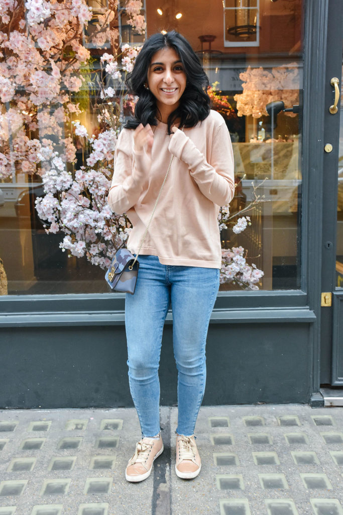 Fashion Blogger Shloka Narang of The Silk Sneaker showcases how to style and wear backless sweaters featuring this Furla bag