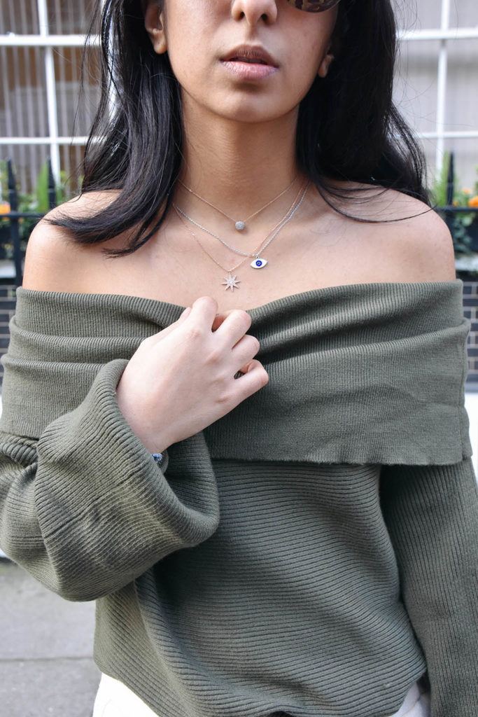 Fashion blogger Shloka Narang of The Silk Sneaker shows how to dress for spring with an off shoulder Zara sweater and Louis Vuitton Pochette Bag