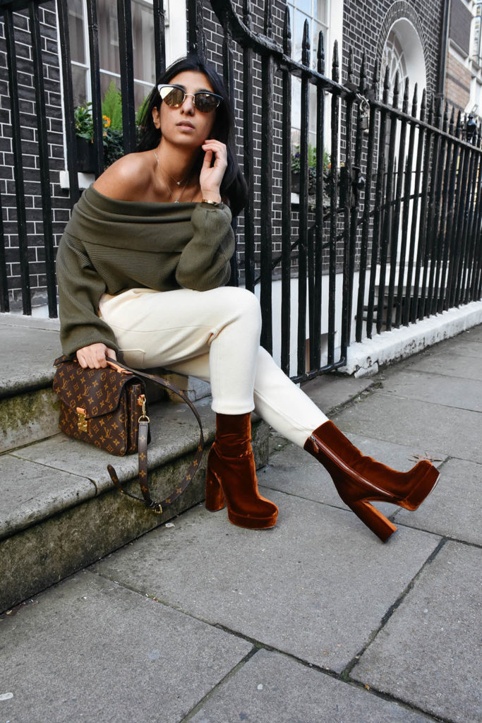 Fashion blogger Shloka Narang of The Silk Sneaker shows how to dress for spring with an off shoulder Zara sweater and Louis Vuitton Pochette Bag