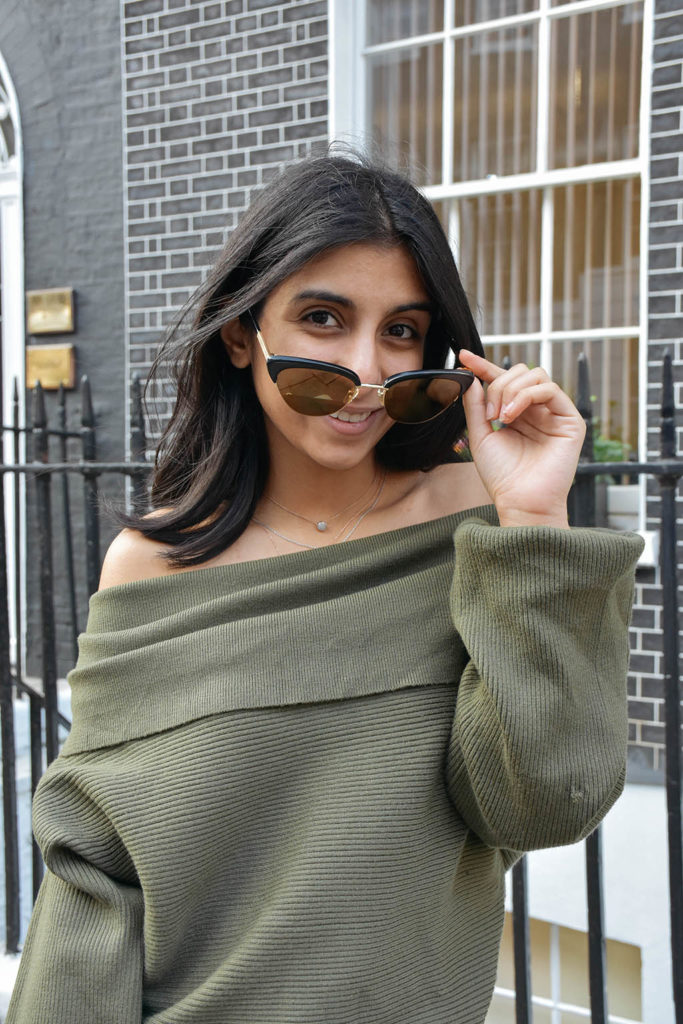 Fashion blogger Shloka Narang of The Silk Sneaker shows how to dress for spring with an off shoulder Zara sweater and Louis Vuitton Pochette Bag