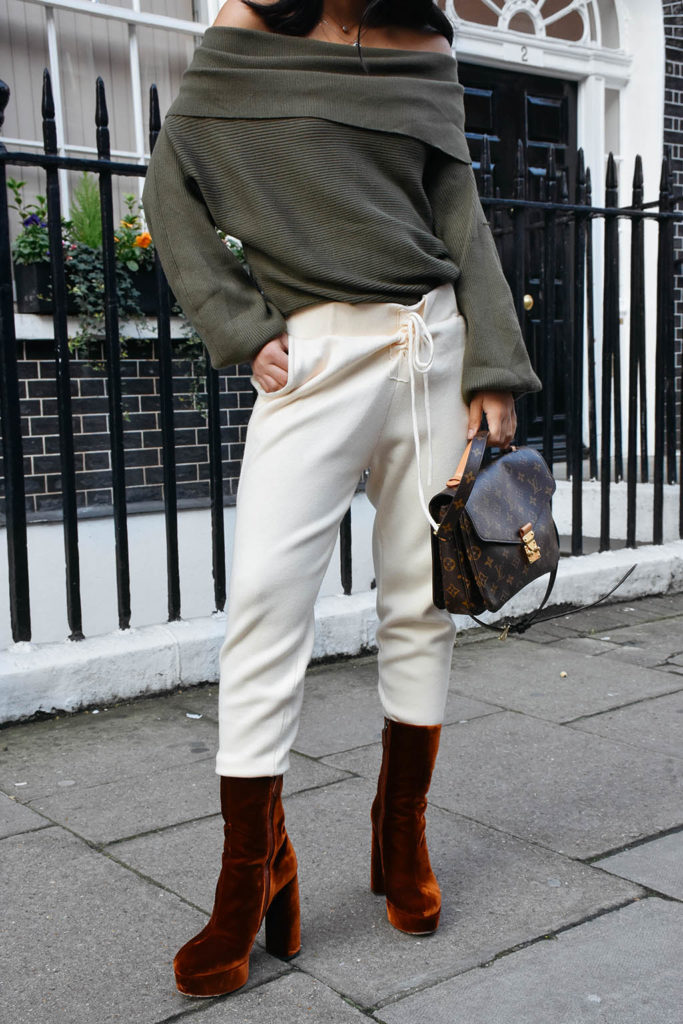 Fashion blogger Shloka Narang of The Silk Sneaker shows how to dress for spring with an off shoulder Zara sweater and Louis Vuitton Pochette Bag