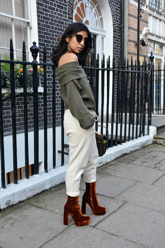 Fashion blogger Shloka Narang of The Silk Sneaker shows how to dress for spring with an off shoulder Zara sweater and Louis Vuitton Pochette Bag