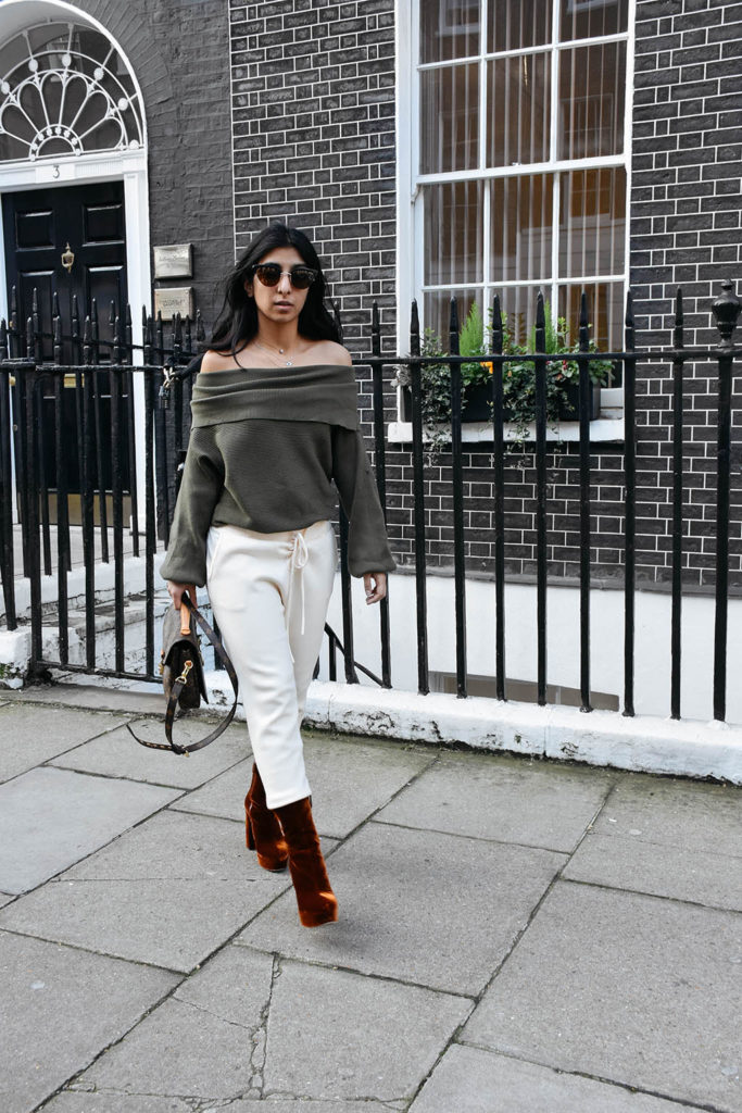 Fashion blogger Shloka Narang of The Silk Sneaker shows how to dress for spring with an off shoulder Zara sweater and Louis Vuitton Pochette Bag