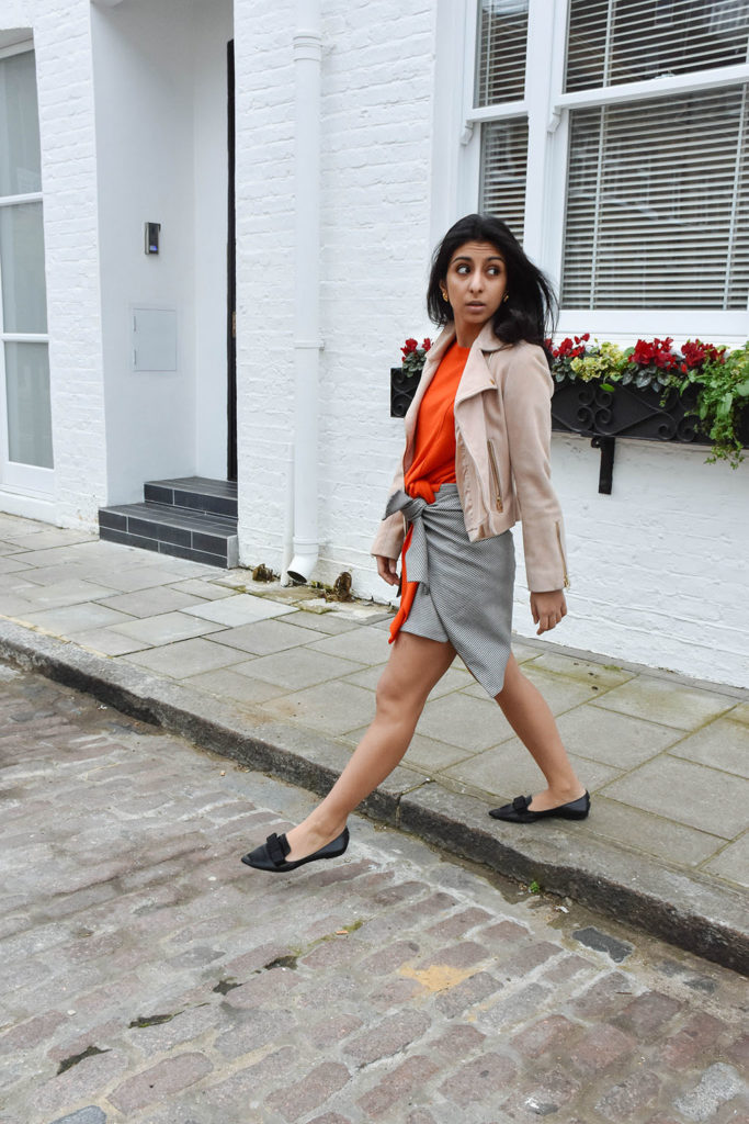 Fashion blogger Shloka Narang of The Silk Sneaker showcases how to combine spring colour combination pink and orange featuring Daniel Wellington