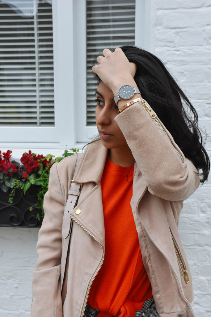 Fashion blogger Shloka Narang of The Silk Sneaker showcases how to combine spring colour combination pink and orange featuring Daniel Wellington
