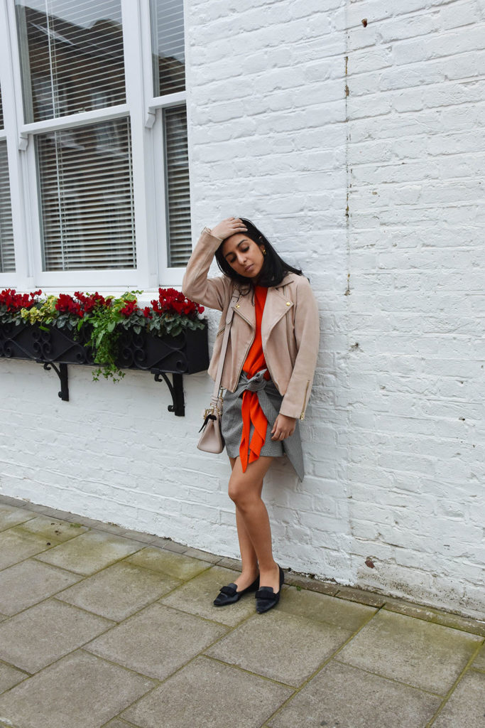 Fashion blogger Shloka Narang of The Silk Sneaker showcases how to combine spring colour combination pink and orange featuring Daniel Wellington