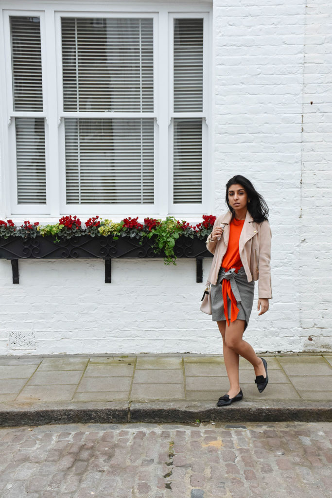 Fashion blogger Shloka Narang of The Silk Sneaker showcases how to combine spring colour combination pink and orange featuring Daniel Wellington