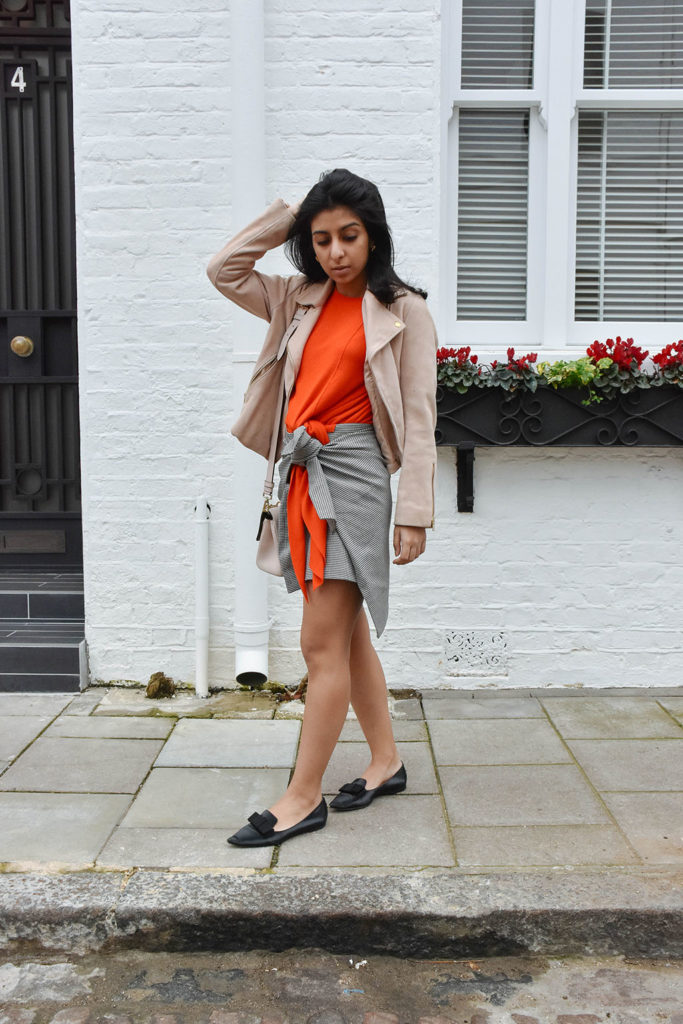 Fashion blogger Shloka Narang of The Silk Sneaker showcases how to combine spring colour combination pink and orange featuring Daniel Wellington