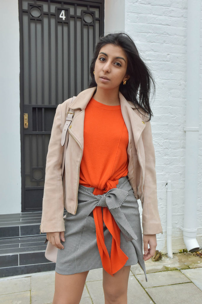 Fashion blogger Shloka Narang of The Silk Sneaker showcases how to combine spring colour combination pink and orange featuring Daniel Wellington