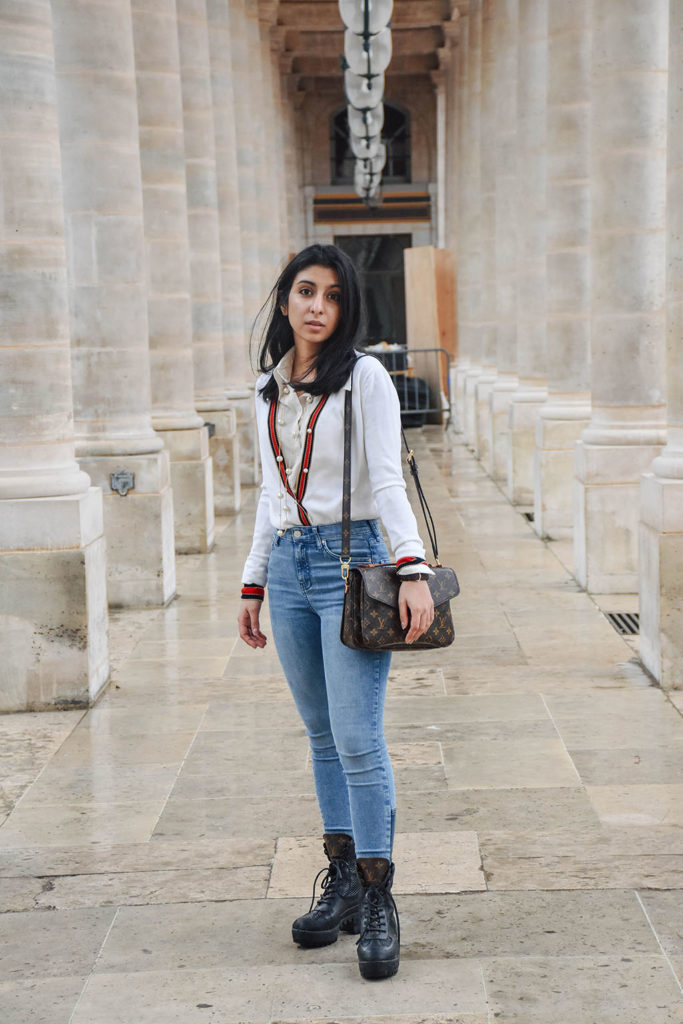 Fashion blogger Shloka Narang of The Silk Sneaker showcases a chic outfit in Paris featuring a Gucci Sweater