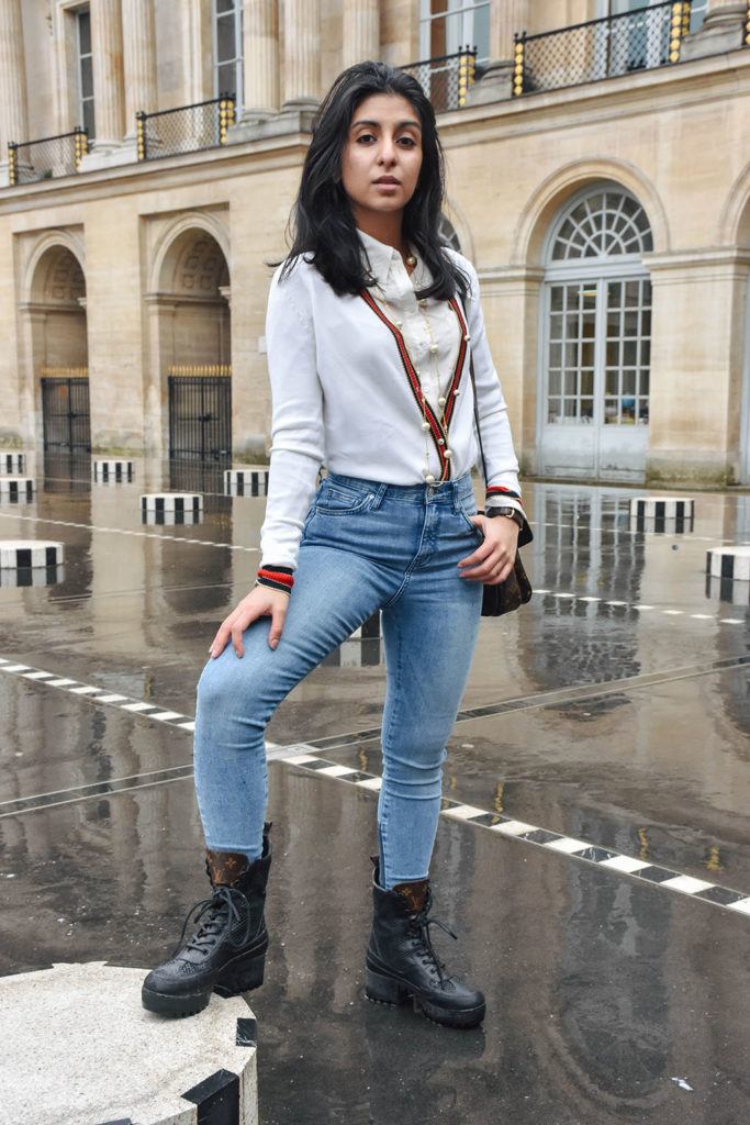 Fashion blogger Shloka Narang of The Silk Sneaker showcases a chic outfit in Paris featuring a Gucci Sweater