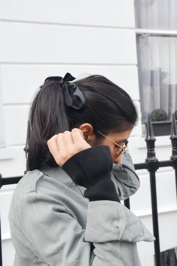 Fashion blogger Shloka Narang of The Silk Sneaker showcases an easy style tip to make a spring dress feel new again with & Other Stories Dress and Zara jacket