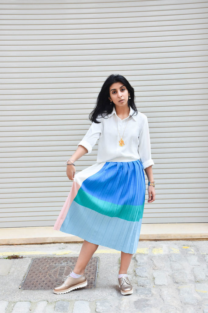 Fashion blogger Shloka Narang styles a maxi skirt outfit featuring a pastel colour block skirt and denim jacket