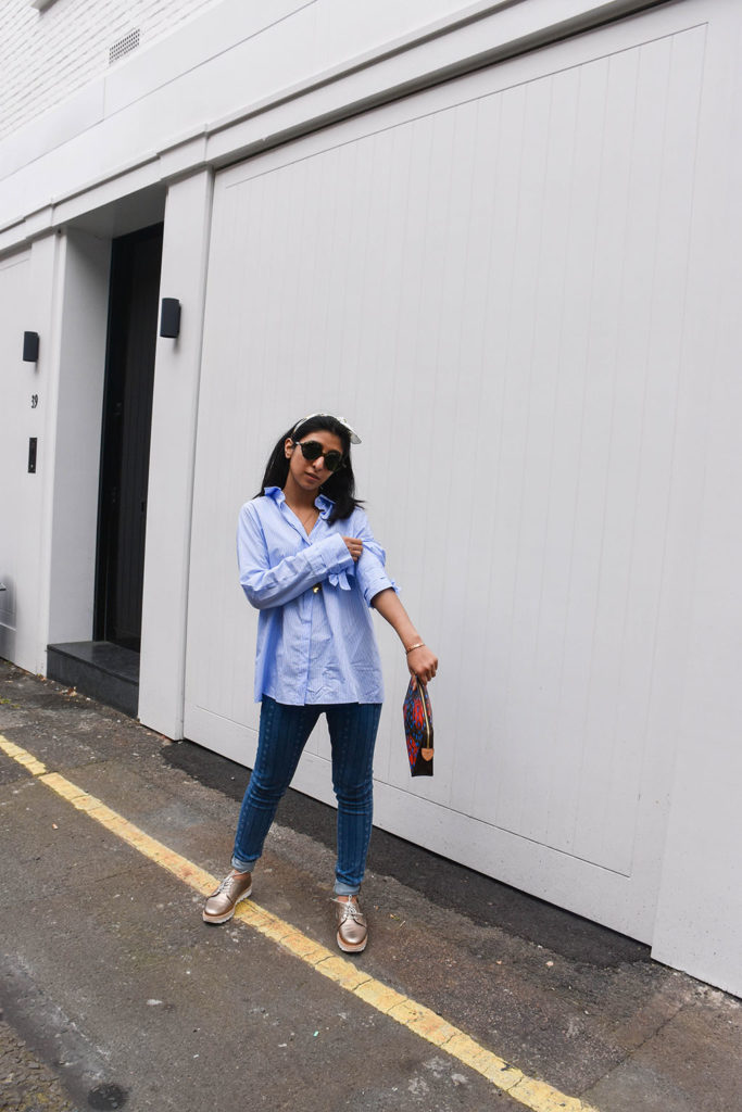 Fashion blogger Shloka Narang showcases how to use a scarf as a headband in the latest bandana hairstyle trend