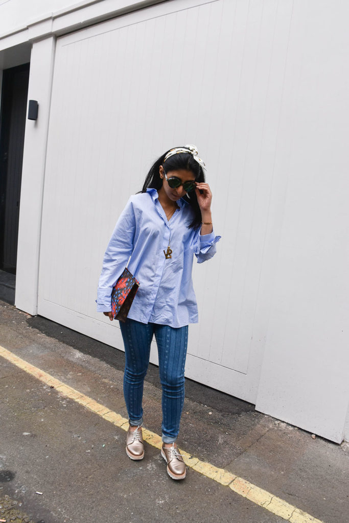 Fashion blogger Shloka Narang showcases how to use a scarf as a headband in the latest bandana hairstyle trend