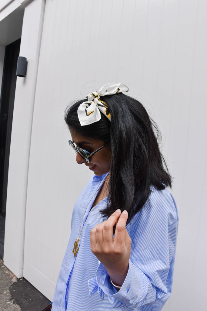 Fashion blogger Shloka Narang showcases how to use a scarf as a headband in the latest bandana hairstyle trend