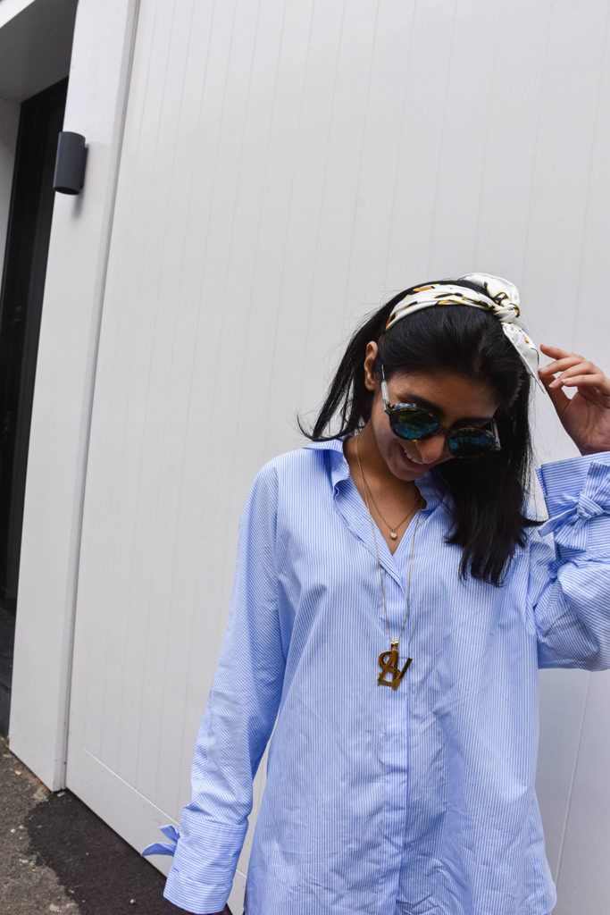 Fashion blogger Shloka Narang showcases how to use a scarf as a headband in the latest bandana hairstyle trend