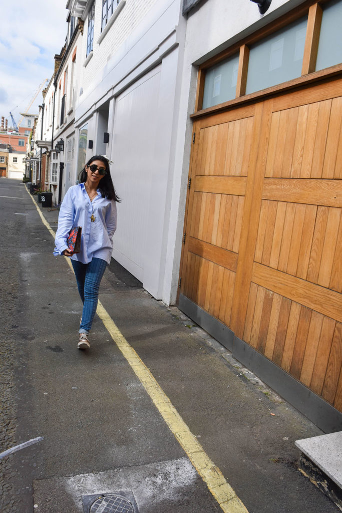 Fashion blogger Shloka Narang showcases how to use a scarf as a headband in the latest bandana hairstyle trend