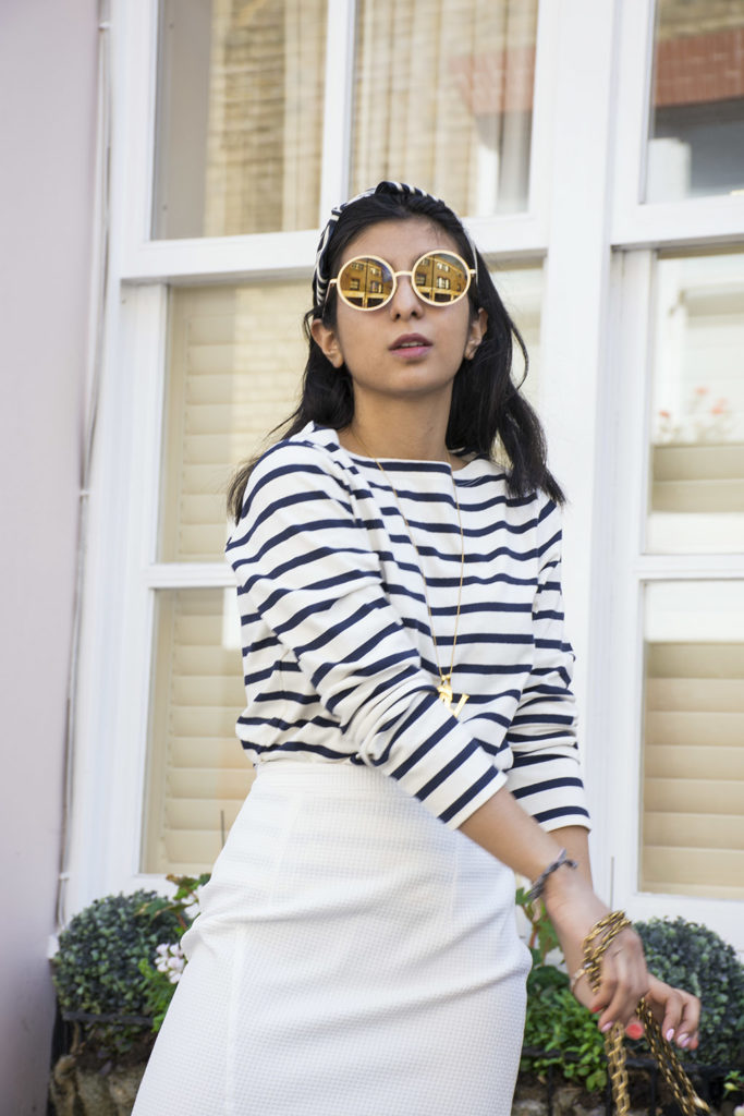 Fashion blogger Shloka Narang of The Silk Sneaker showcases how to wear a striped outfit for summer street style