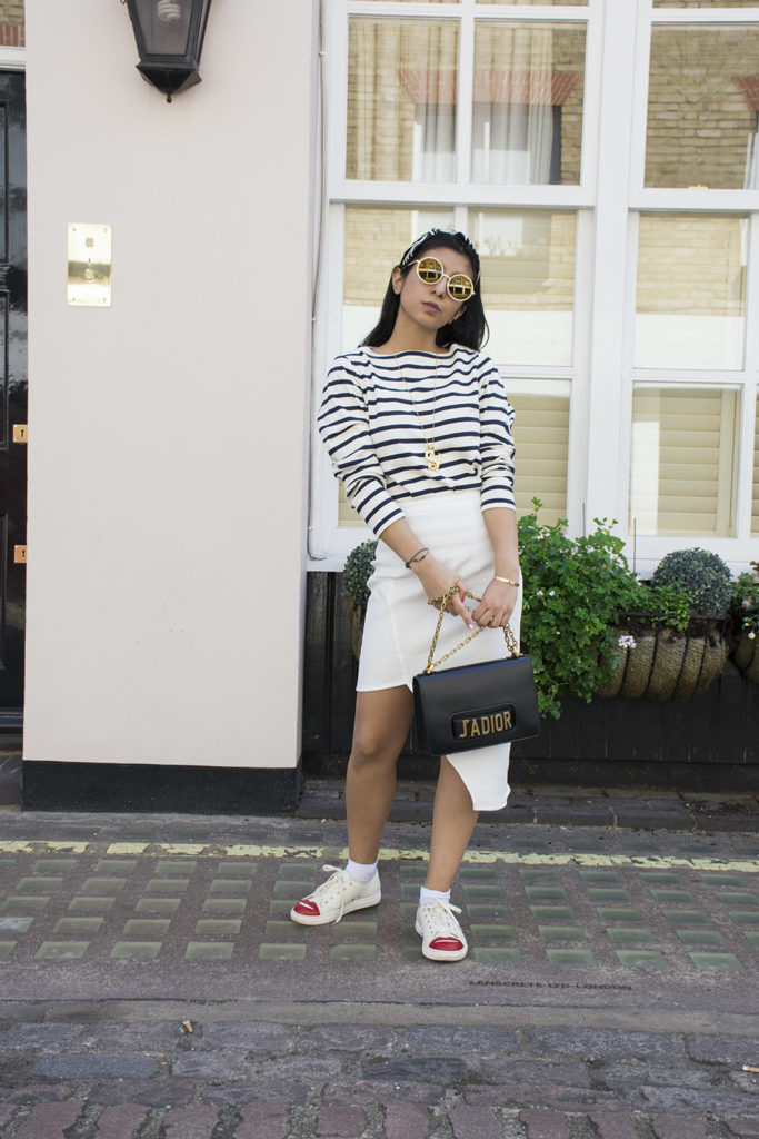 Fashion blogger Shloka Narang of The Silk Sneaker showcases how to wear a striped outfit for summer street style