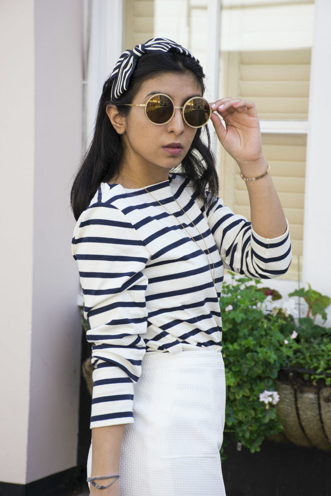 Fashion blogger Shloka Narang of The Silk Sneaker showcases how to wear a striped outfit for summer street style