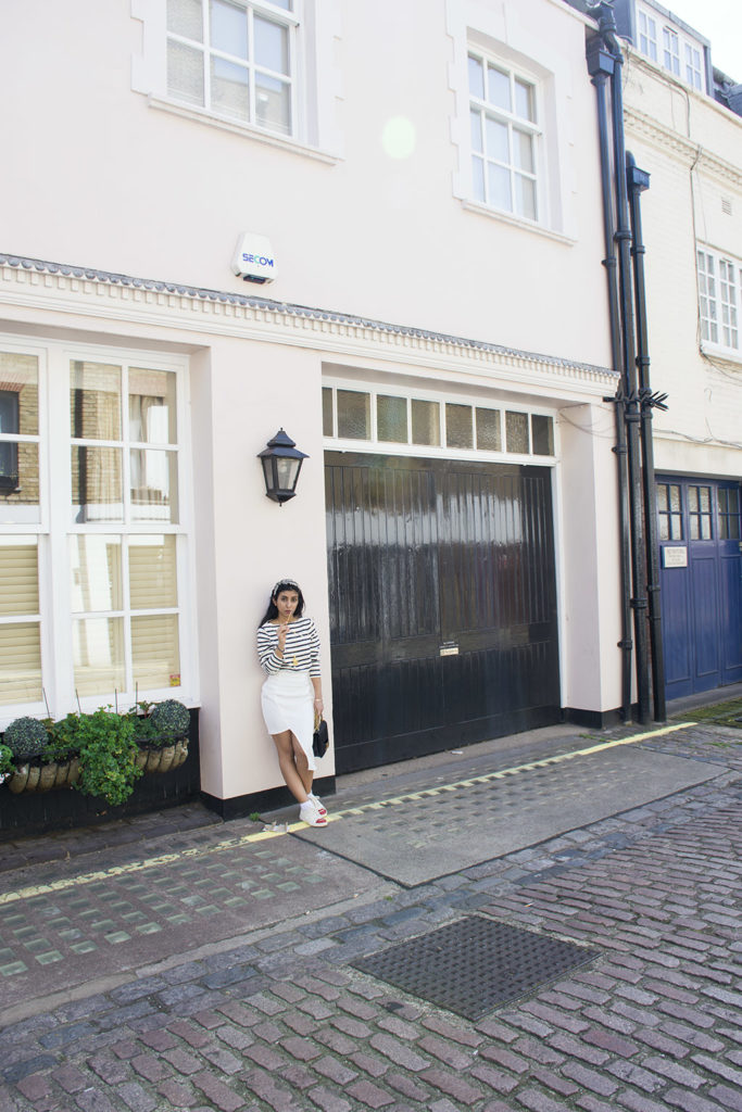 Fashion blogger Shloka Narang of The Silk Sneaker showcases how to wear a striped outfit for summer street style