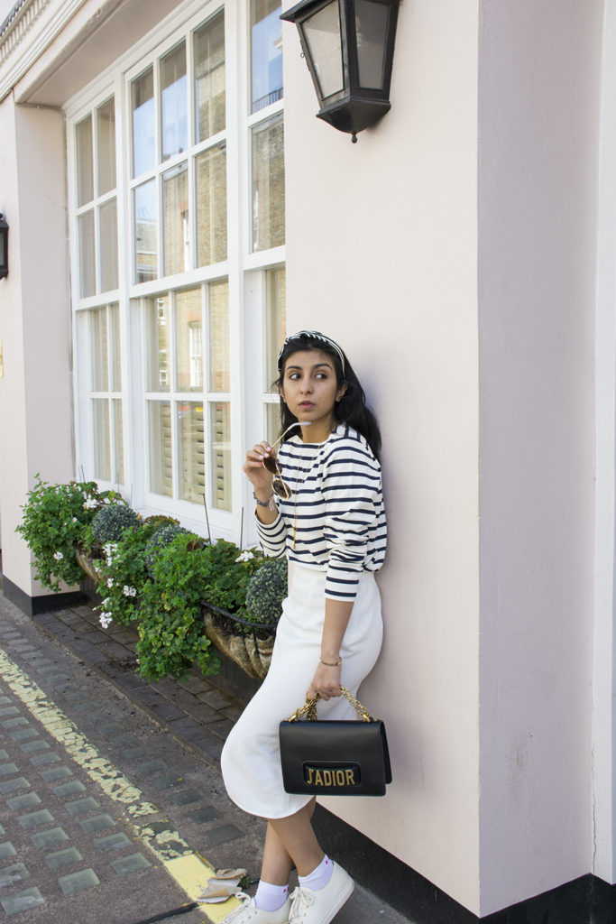 Fashion blogger Shloka Narang of The Silk Sneaker showcases how to wear a striped outfit for summer street style