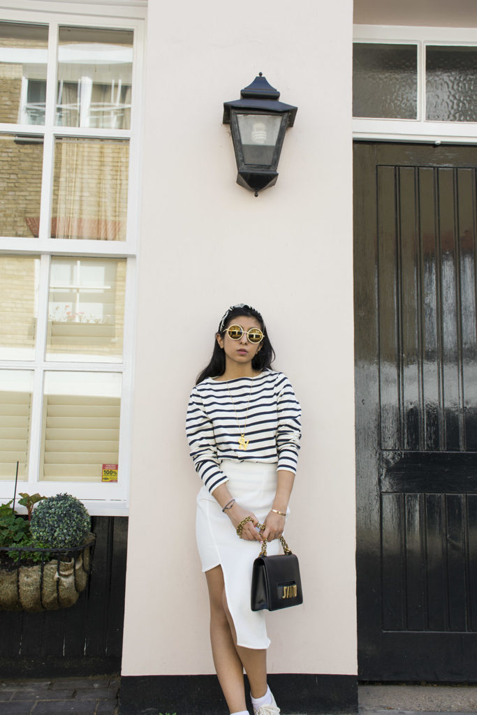 Fashion blogger Shloka Narang of The Silk Sneaker showcases how to wear a striped outfit for summer street style