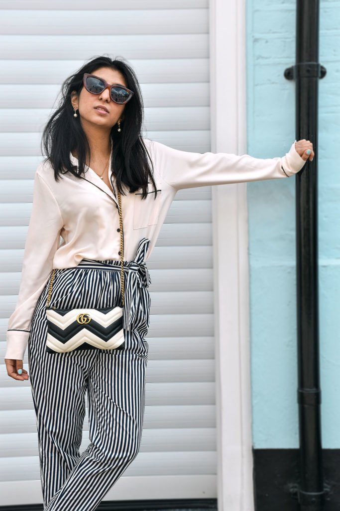 Fashion blogger Shloka Narang showcases how to style striped pants featuring Topshop, Zara and Gucci