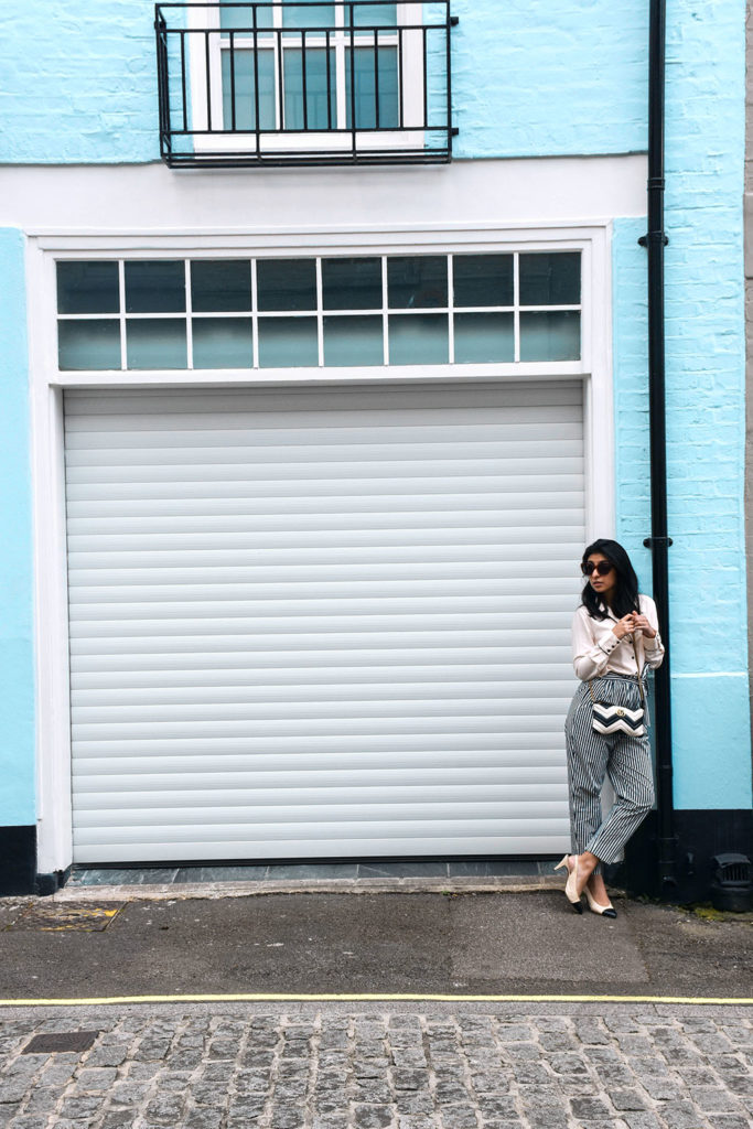 Fashion blogger Shloka Narang showcases how to style striped pants featuring Topshop, Zara and Gucci