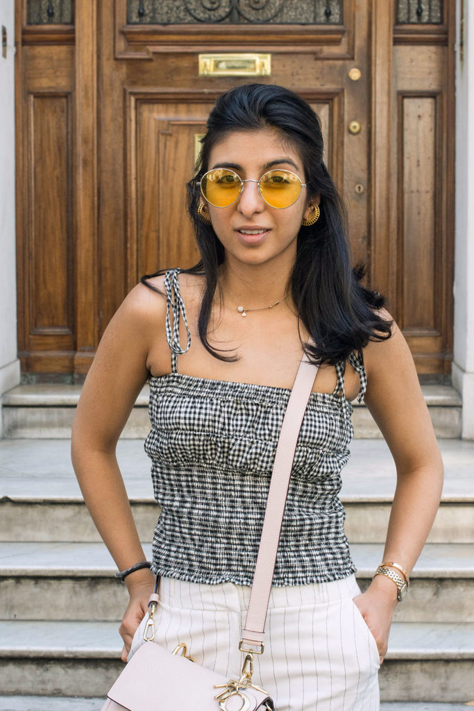 Fashion Blogger Shloka Narang of The Silk Sneaker showcases how to wear an easy summer outfit mixing gingham and stripes
