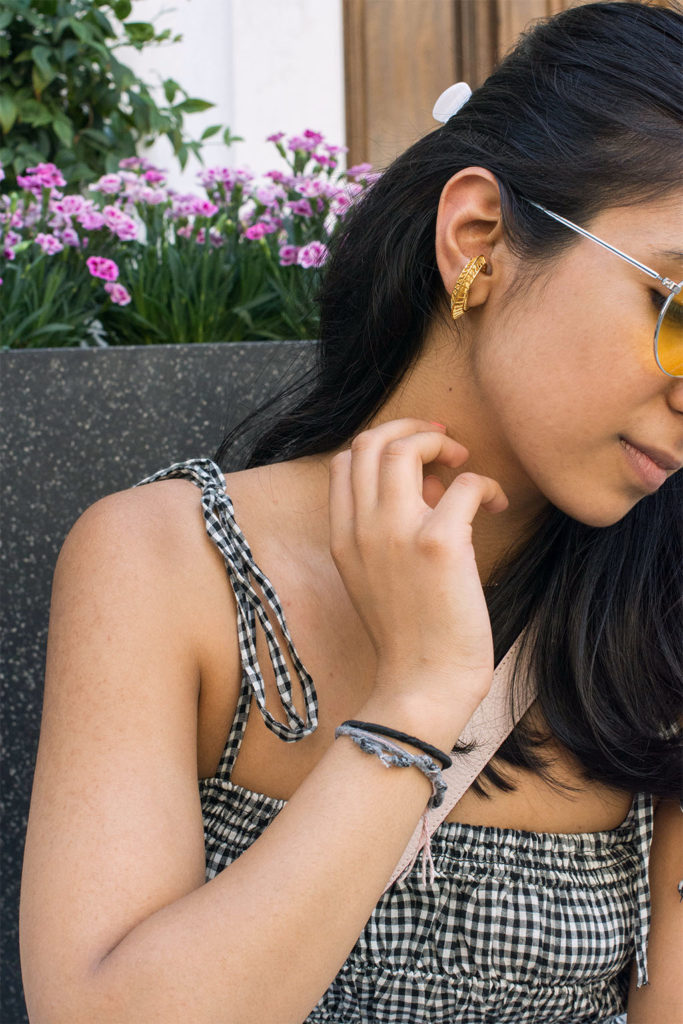 Fashion Blogger Shloka Narang of The Silk Sneaker showcases how to wear an easy summer outfit mixing gingham and stripes