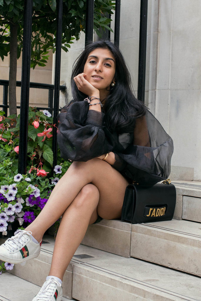 Fashion blogger Shloka Narang of The Silk Sneaker showcases how to wear a sheer top