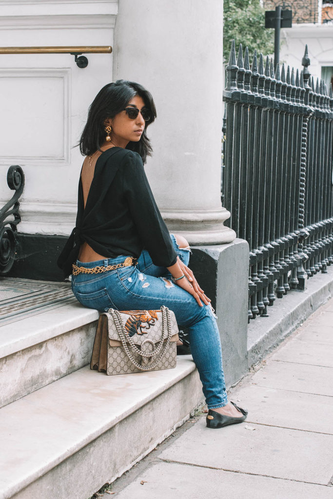 Fashion blogger Shloka Narang of The Silk Sneaker showcases the best top you need for summer to autumn transitional dressing in ba&sh